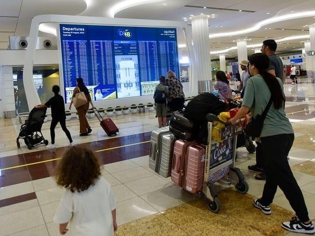 Passengers at Dubai International Airport amid regional flight disruptions