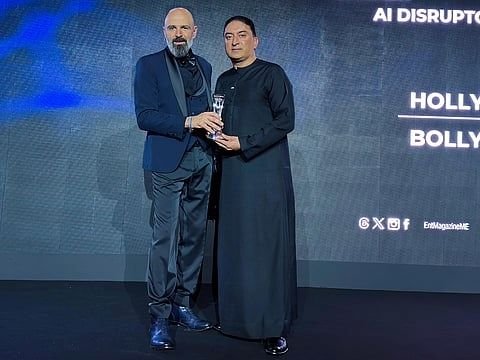 Sheeraz Hasan accepts the AI Disruptor of the Year award for Hollywood.AI and Bollywood.AI at the Tech Innovation Awards 2026 in Dubai