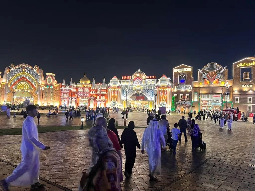 Dubai Global Village illuminated cultural pavilions during the evening in Dubai