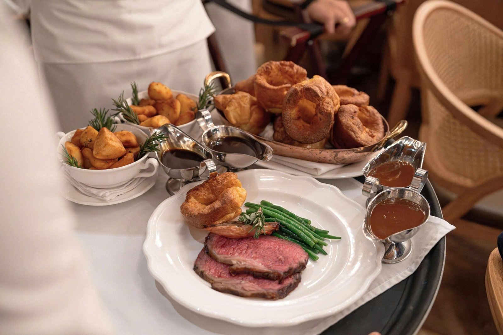 Sunday roast with roast beef, Yorkshire pudding, potatoes, vegetables and gravy at a Dubai restaurant